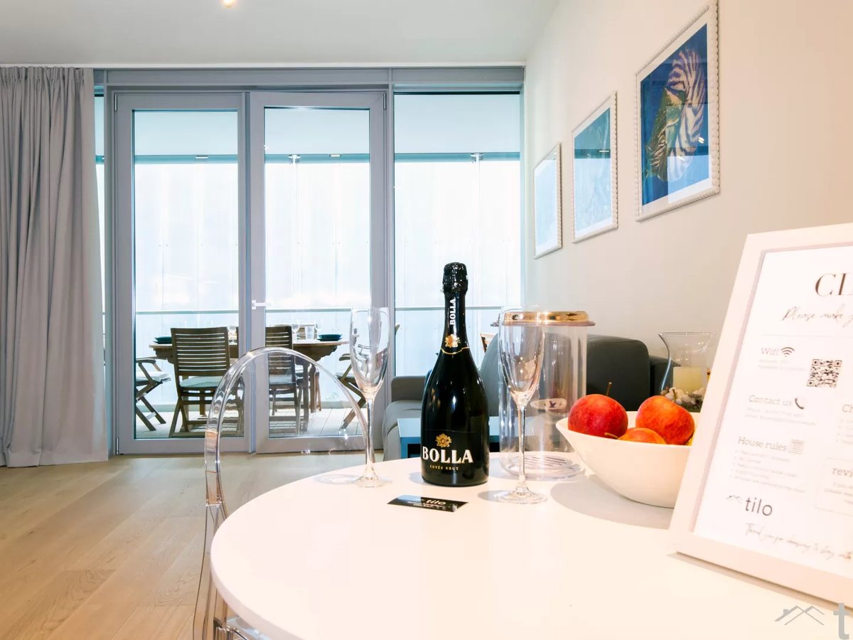 A welcome set on the table and the house card with the Wi-Fi details, check-out time and our number
